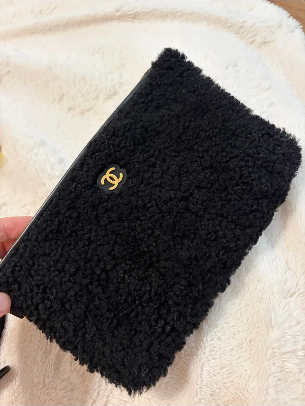 CHANEL Black Shearling Phone Case with Gold CC Emblem